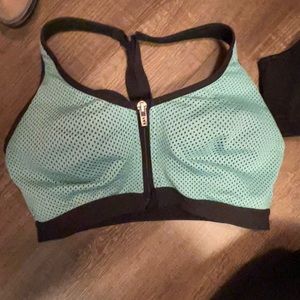 Clasp and zip sports bra